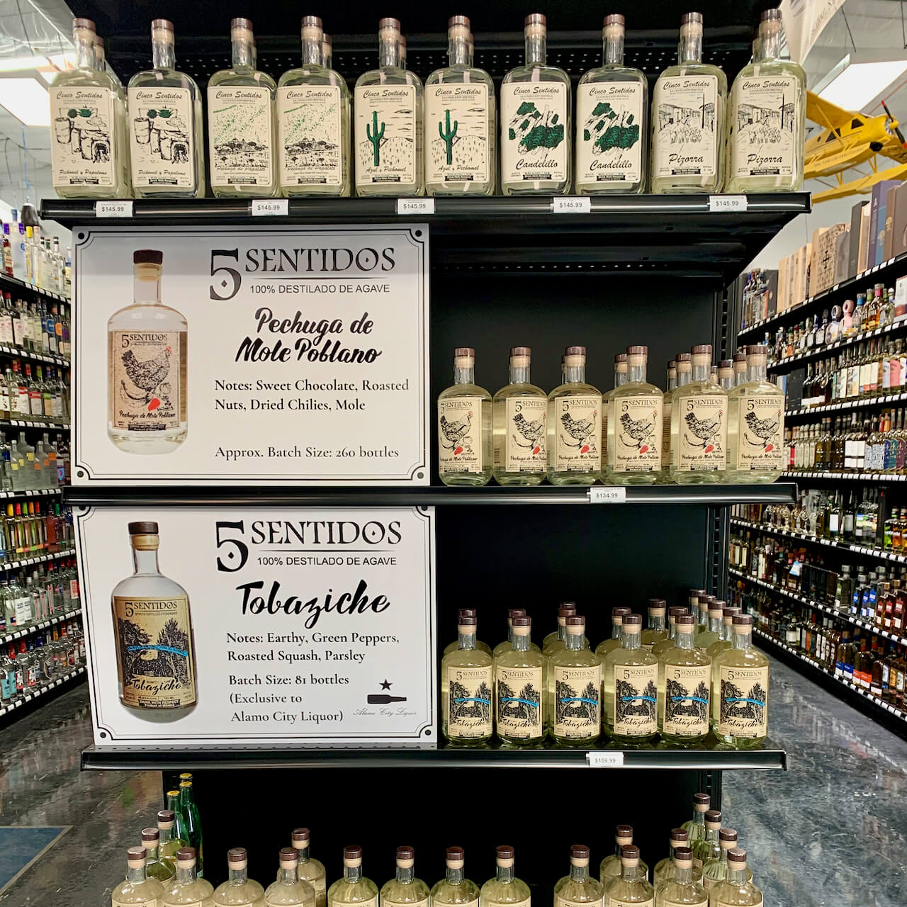 Special display of Cinco Sentidos bottles at Alamo City Liquor in San Antonio