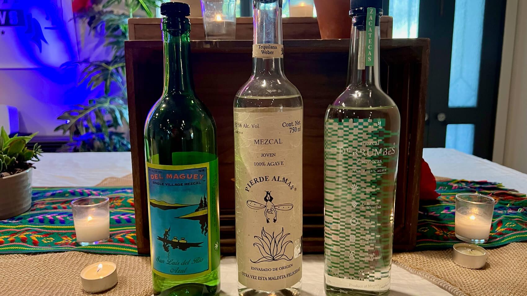 A flight of three bottles of agave azul mezcal