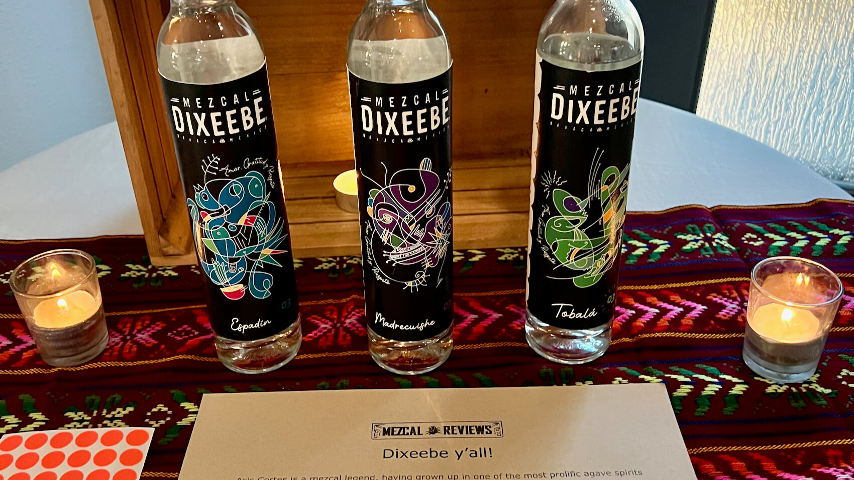 A flight of three bottles of Mezcal Dixeebe
