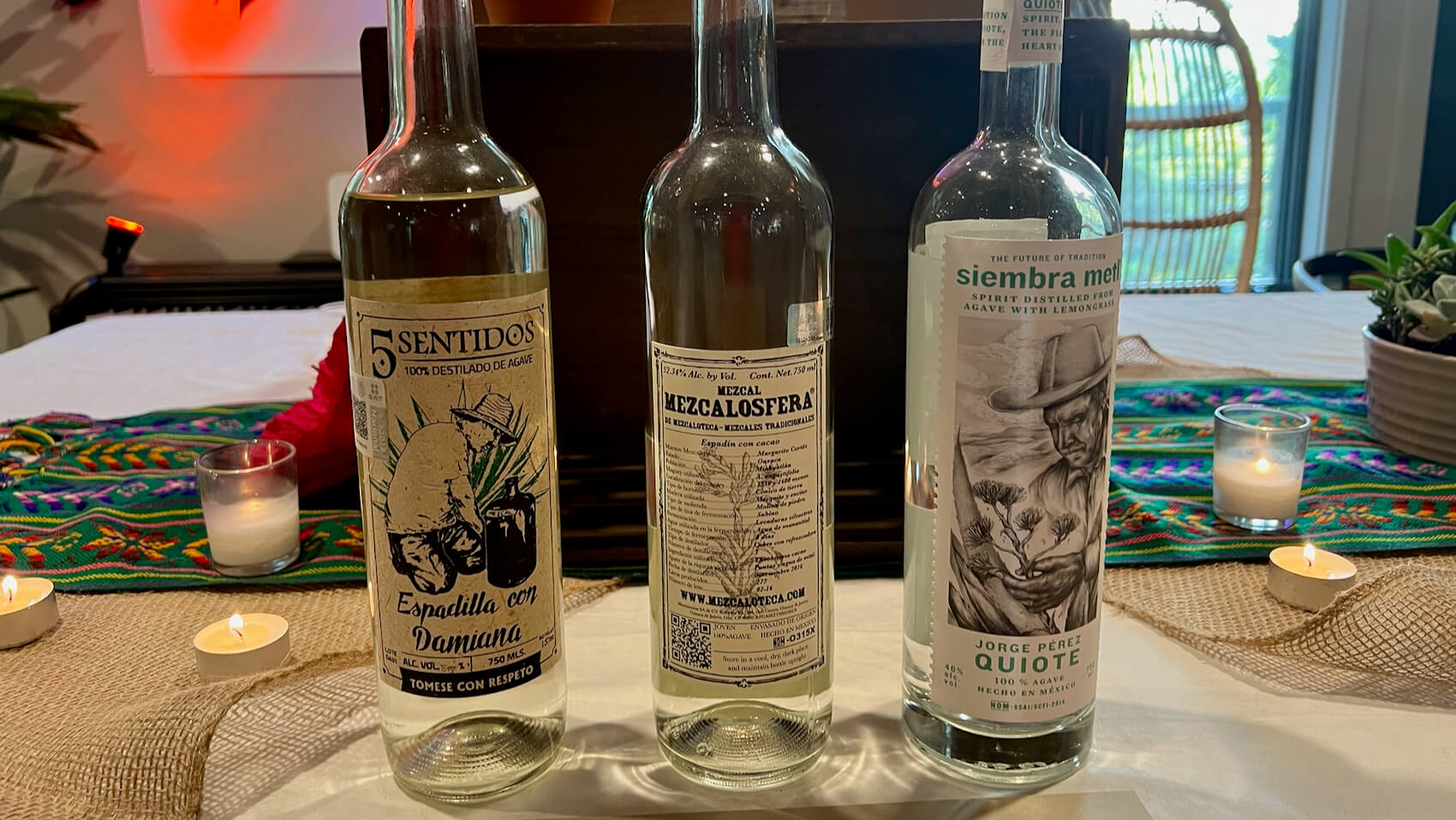 A flight of three bottles of pechuga mezcal
