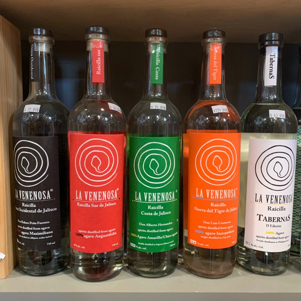 Five different La Venenosa bottles on a retail shelf