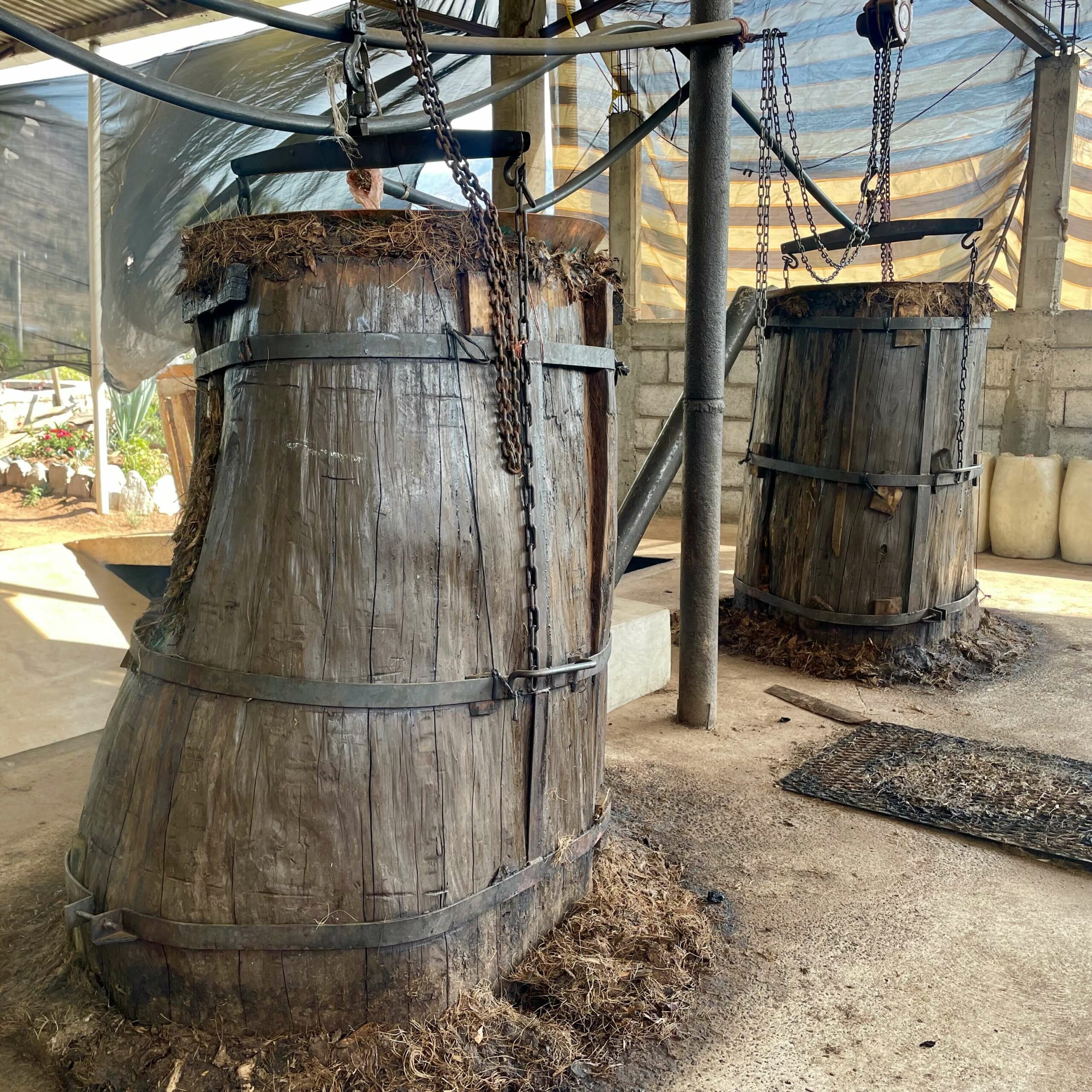 Two Filipino mezcal stills with wooden tops